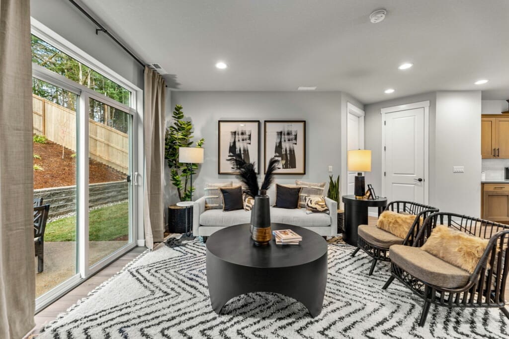 Interior of a Holt Home located in Oregon highlighting a modern living room and open concept floor plan.