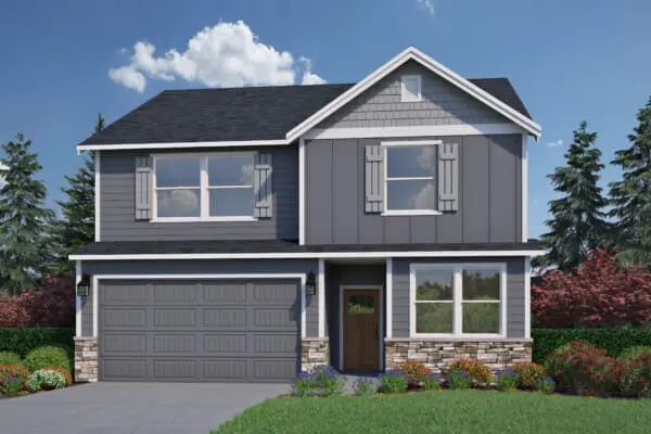 Charming two-story suburban house on SE Heritage Rd near Scouters Mountain. Features gray siding, stone accents, double garage, and a dark brown front door. Lush yard at 10536 boasts green grass, colorful shrubs, and trees under a partly cloudy sky.